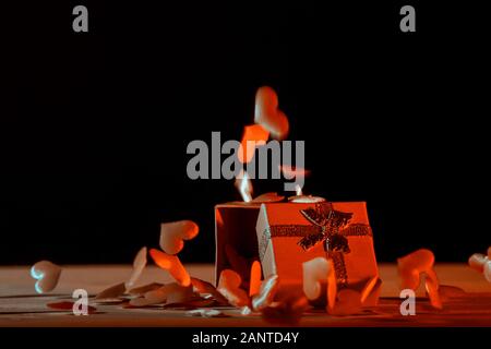 Gift box with hearts on a pink background. Valentine`s day. blue neon banner Art concept Stock Photo